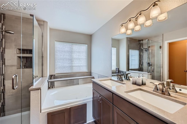 bathroom with shower with separate bathtub and vanity