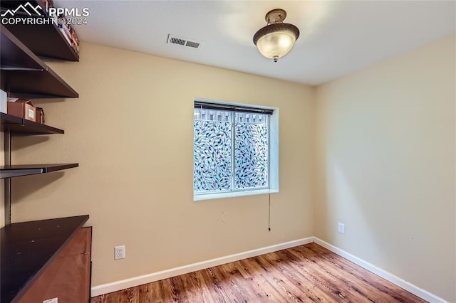 empty room featuring wood-type flooring