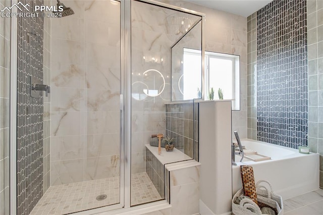 bathroom featuring tile patterned flooring and independent shower and bath