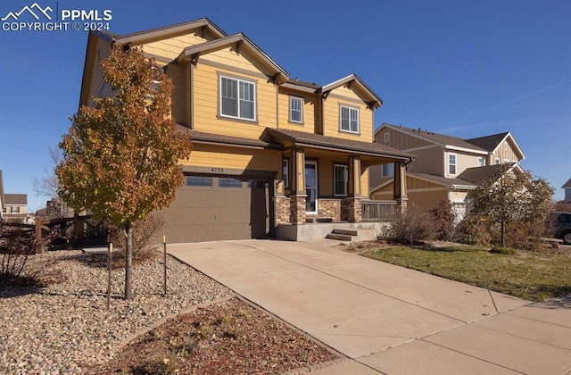 craftsman-style house with a porch and a garage