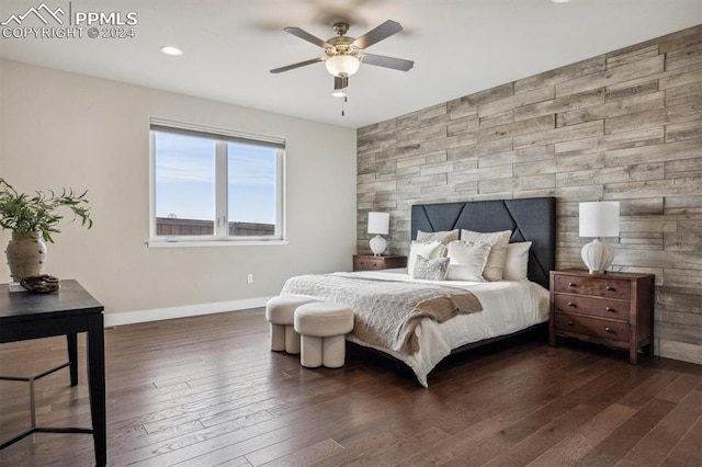 bedroom featuring ceiling fan and dark hardwood / wood-style floors