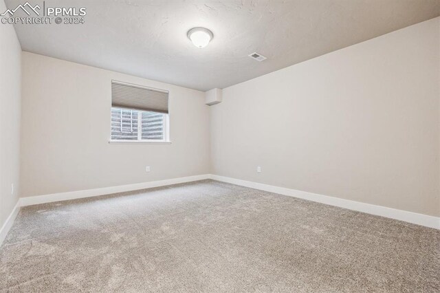 7680 Almond Wood Loop, Colorado Springs, CO 80908 - carpeted empty room featuring baseboards
