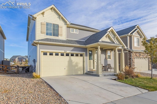 craftsman-style home featuring a porch and a garage