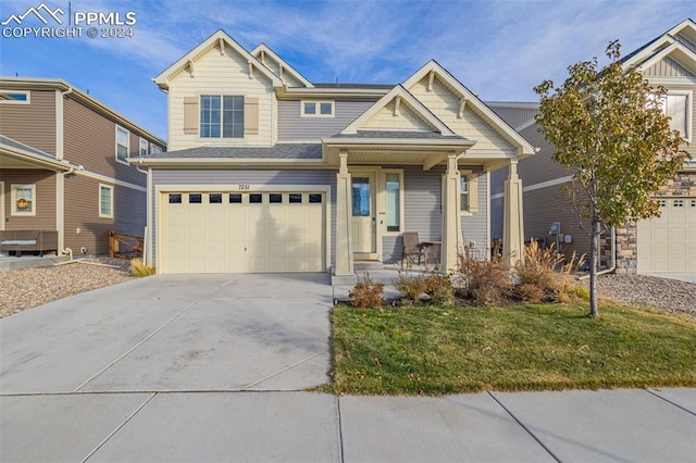 craftsman-style house with a front yard and a garage