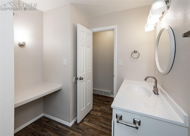 bathroom featuring vanity and hardwood / wood-style flooring