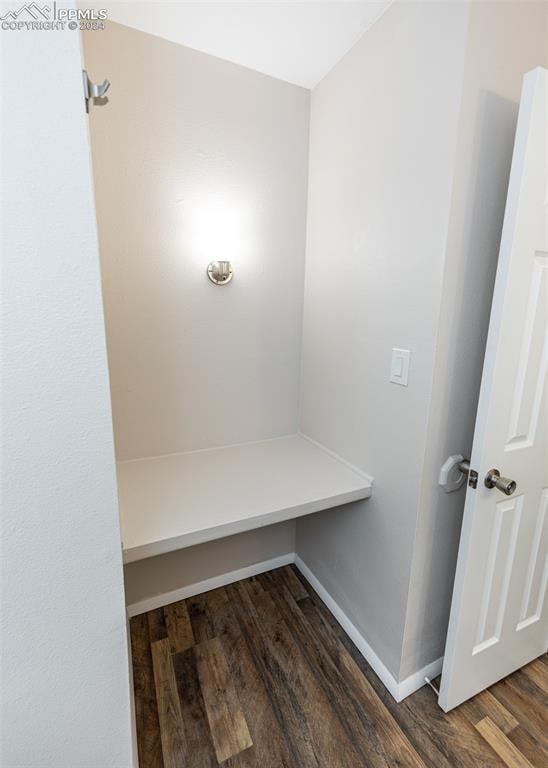 mudroom with dark wood-type flooring