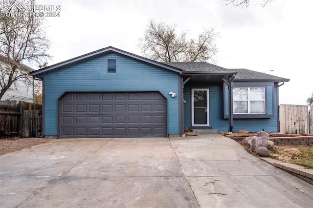 ranch-style home with a garage