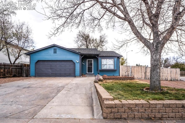 ranch-style house featuring a garage