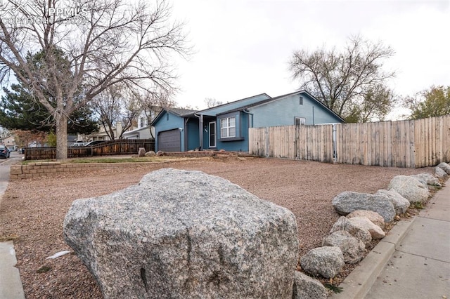 ranch-style home with a garage