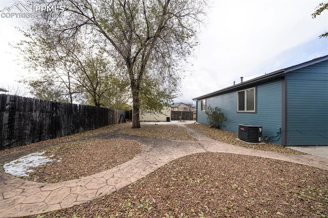 view of yard featuring central AC