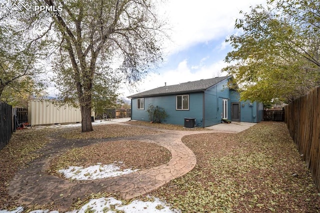 back of house featuring central AC unit and a patio area