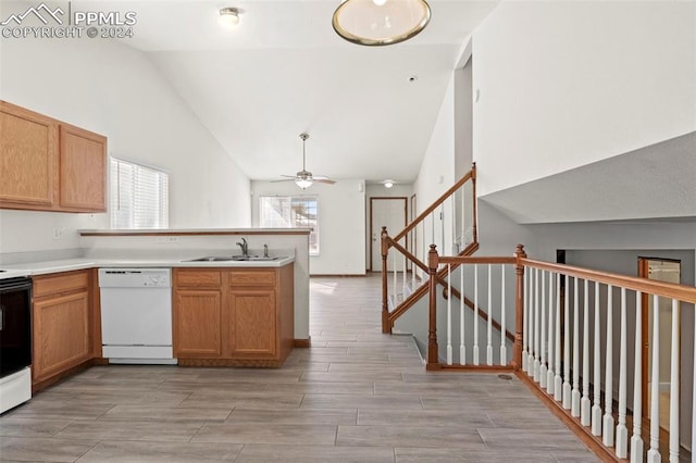 kitchen featuring white appliances, high vaulted ceiling, ceiling fan, and sink