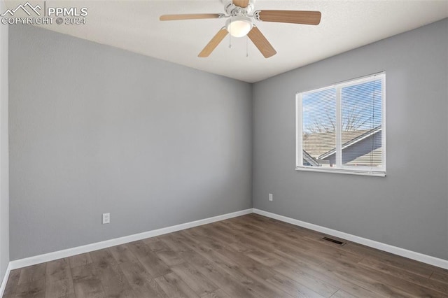 unfurnished room featuring ceiling fan and wood-type flooring