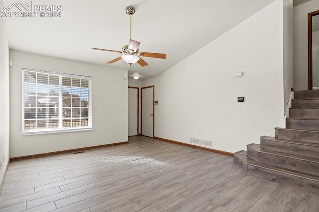 spare room with ceiling fan and light hardwood / wood-style flooring