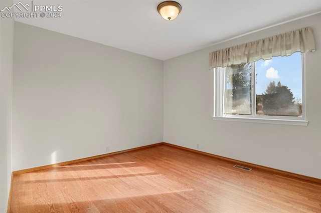 empty room featuring hardwood / wood-style floors