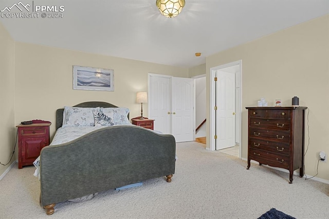 bedroom with light colored carpet