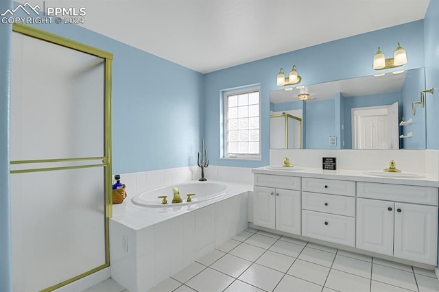 bathroom featuring tile patterned flooring, vanity, and independent shower and bath