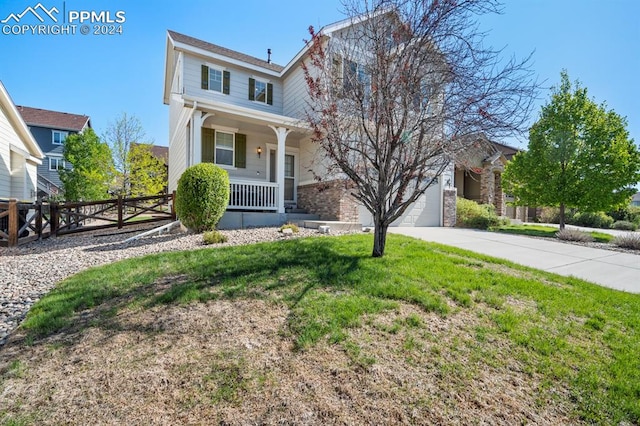 view of front of home with covered porch and a front yard