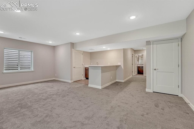 basement with light carpet