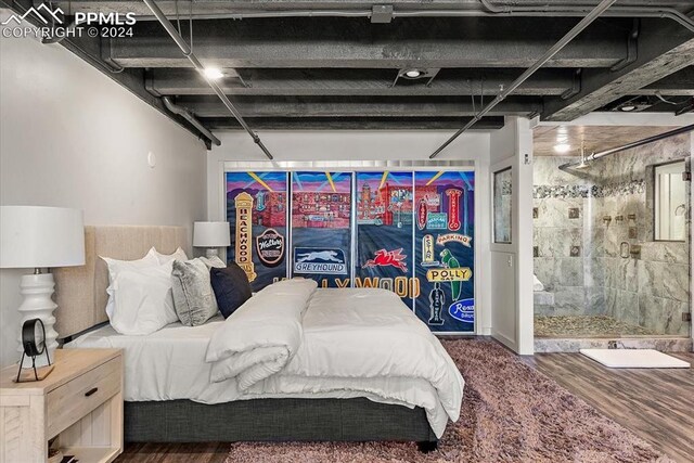 bedroom with dark wood-type flooring