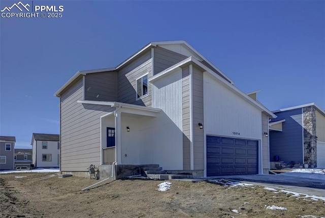 view of front of property featuring an attached garage and driveway