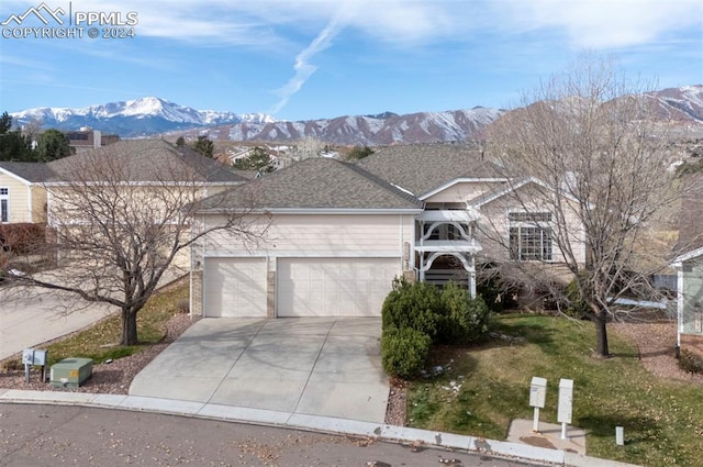 view of front of house featuring a mountain view and a garage