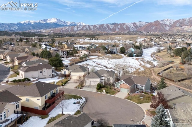 birds eye view of property with a mountain view