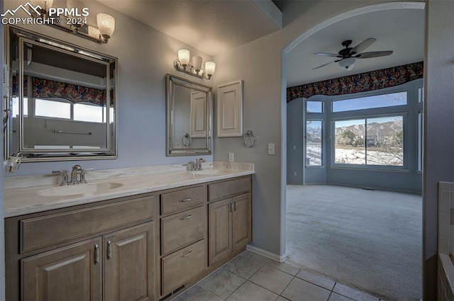 bathroom featuring tile patterned floors, ceiling fan, and vanity