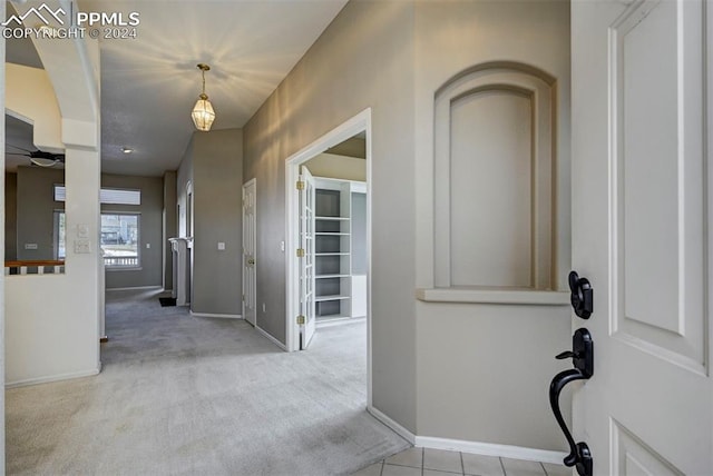 view of carpeted foyer entrance