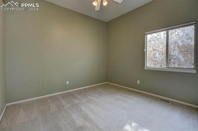 carpeted empty room with ceiling fan