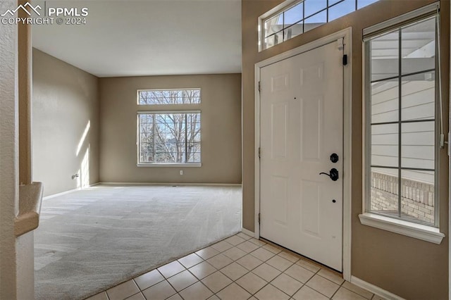 entrance foyer with light carpet