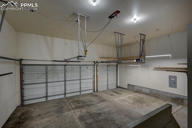 garage with electric panel and a garage door opener