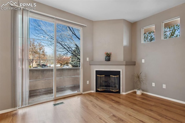 unfurnished living room with hardwood / wood-style floors