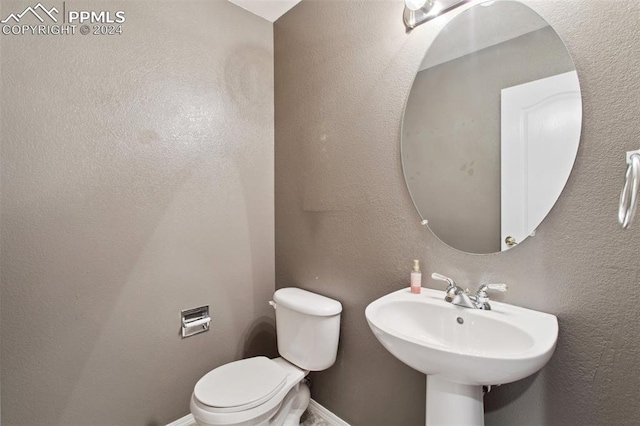 bathroom with toilet and sink