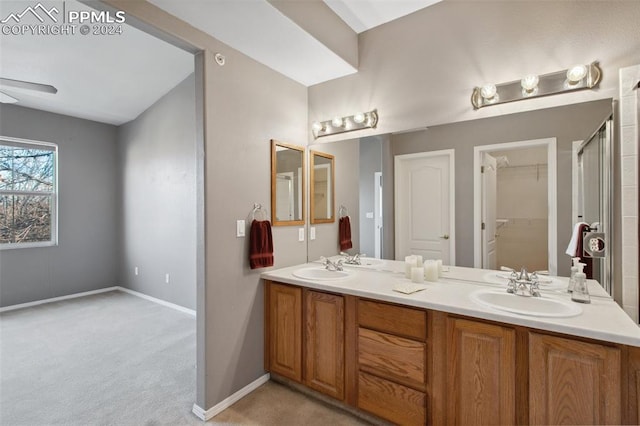 bathroom featuring ceiling fan and vanity