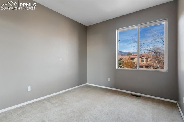 empty room featuring light colored carpet