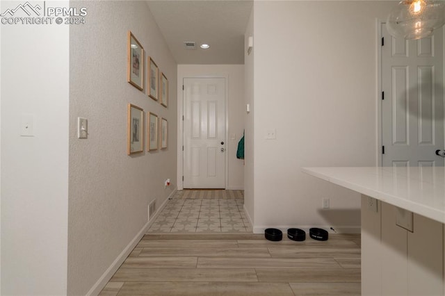 hallway featuring light wood-type flooring