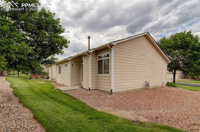 view of property exterior featuring a yard