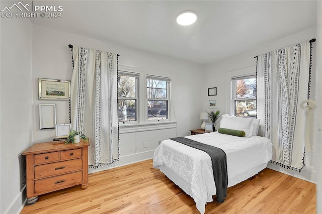 bedroom with light hardwood / wood-style floors