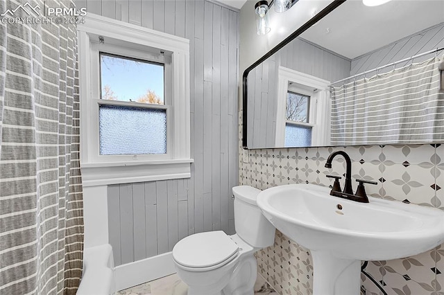 3 S 8th St, Colorado Springs, CO 80905 - bathroom with toilet, a shower with curtain, and wood walls
