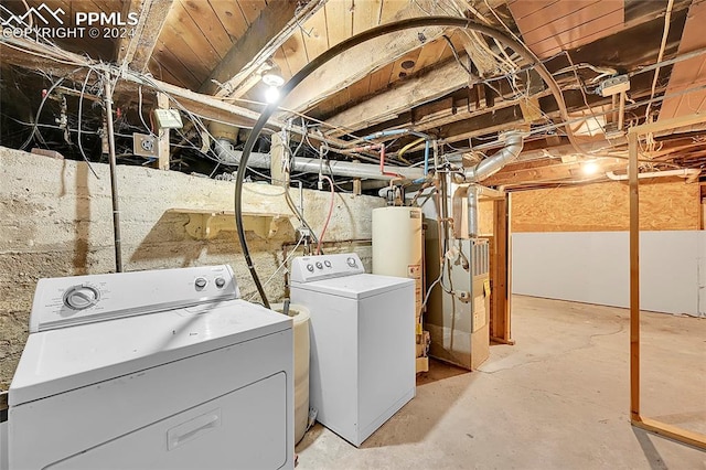 laundry room featuring heating unit, independent washer and dryer, and water heater