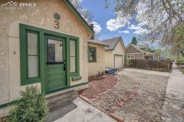 3 S 8th St, Colorado Springs, CO 80905 - entrance to property with concrete driveway, stucco siding, and a garage