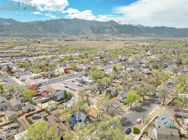 3 S 8th St, Colorado Springs, CO 80905 - aerial overview of property's location featuring a mountain backdrop and nearby suburban area