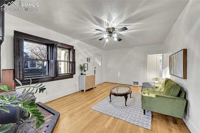 3 S 8th St, Colorado Springs, CO 80905 - living room featuring baseboards and wood finished floors
