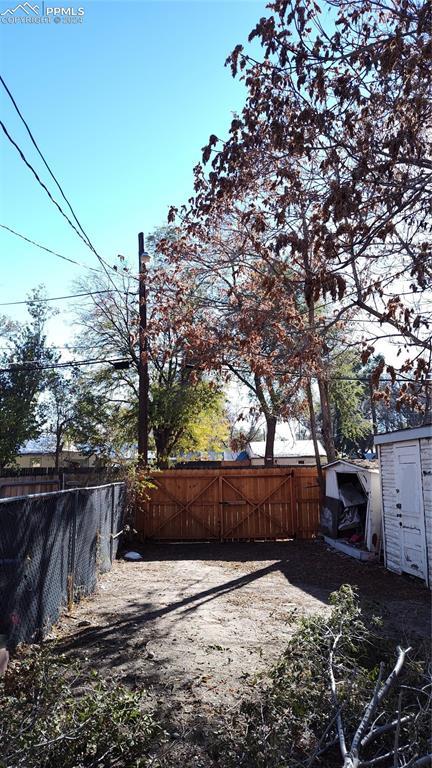 206 W Arroyo Ave, Pueblo, CO 81004 - view of yard with a gate and fence