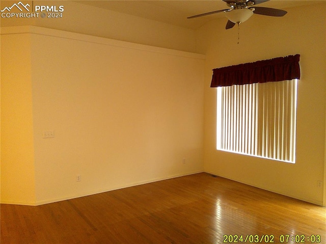 empty room featuring ceiling fan and hardwood / wood-style floors