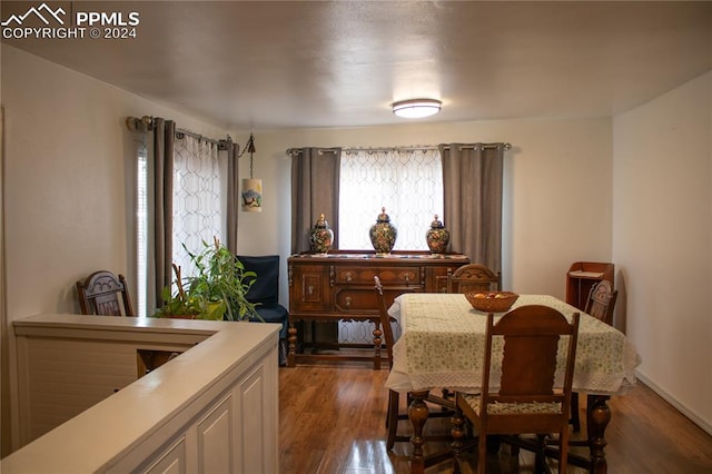 dining room with dark hardwood / wood-style floors