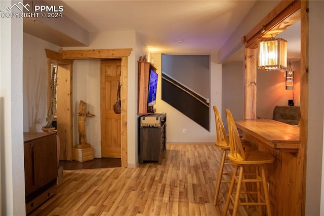 corridor with wood-type flooring