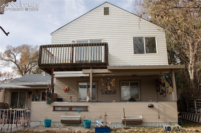 view of front of property with a balcony