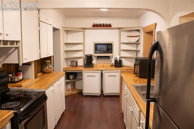 kitchen with white cabinetry, wooden counters, and black appliances